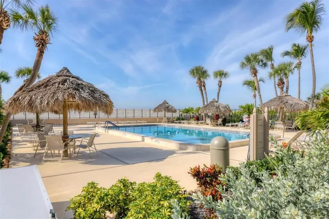 a view of a swimming pool with a yard