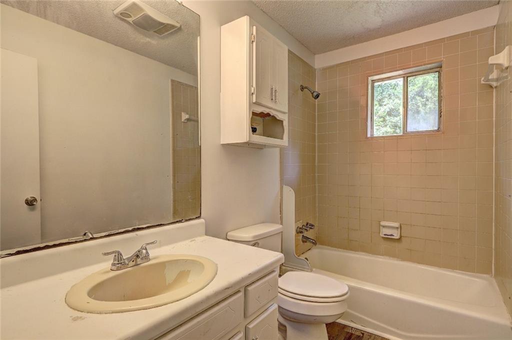 3266 Betty Place Macon, GA 31217 - Photo 10 of 10 a bathroom with a sink toilet and shower