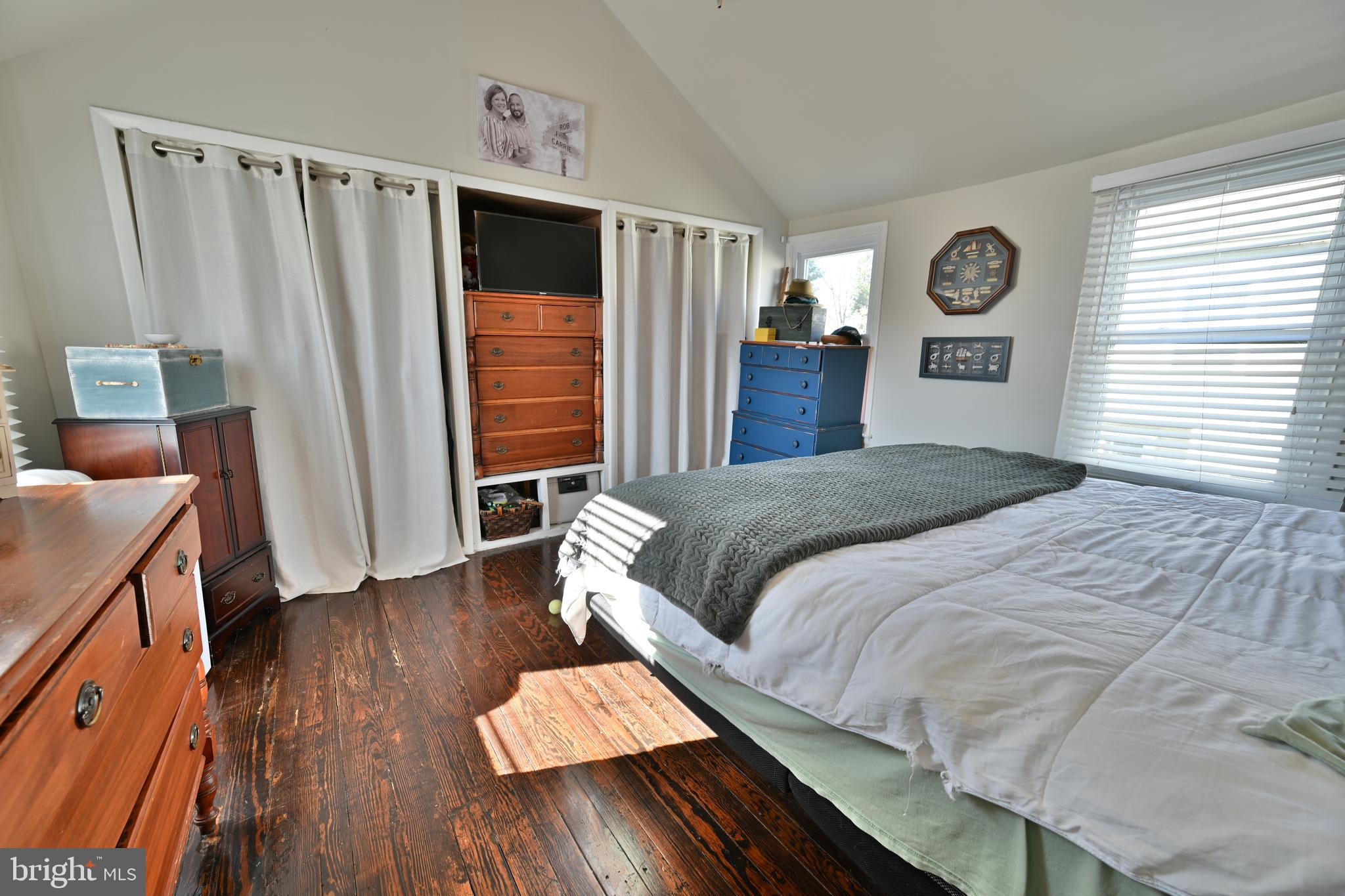 24734 East Main Street Columbus, NJ 08022 - Photo 12 of 24 a bed sitting in a bedroom next to a window