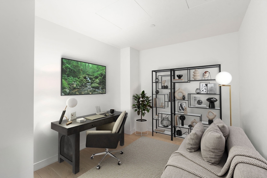 150 Seaport Boulevard, Unit 8A Boston, MA 02210 - Photo 16 of 27 a living room with furniture