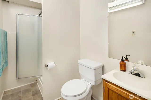 a white toilet sitting next to a bathroom sink