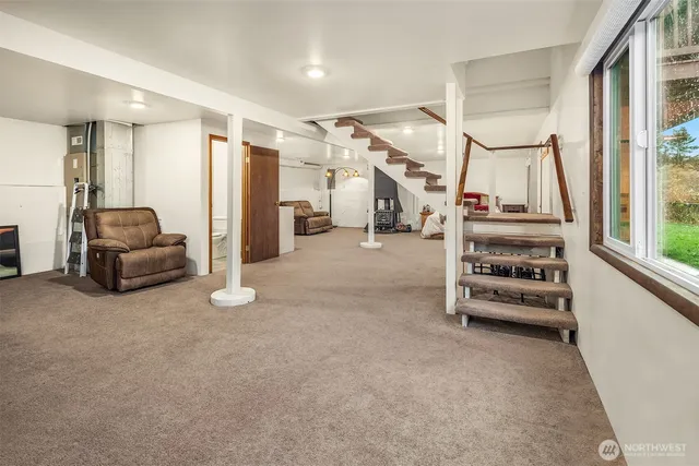 a view of a livingroom with furniture and a flat screen tv