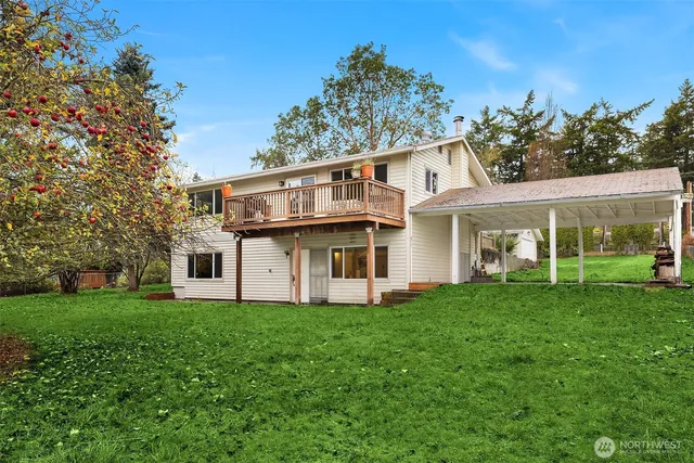 a front view of a house with a garden and porch
