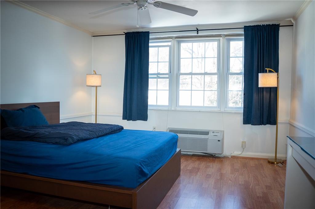 5025 Fifth Avenue, Unit 3F Pittsburgh, PA 15232 - Photo 11 of 22 a bedroom with a bed and window