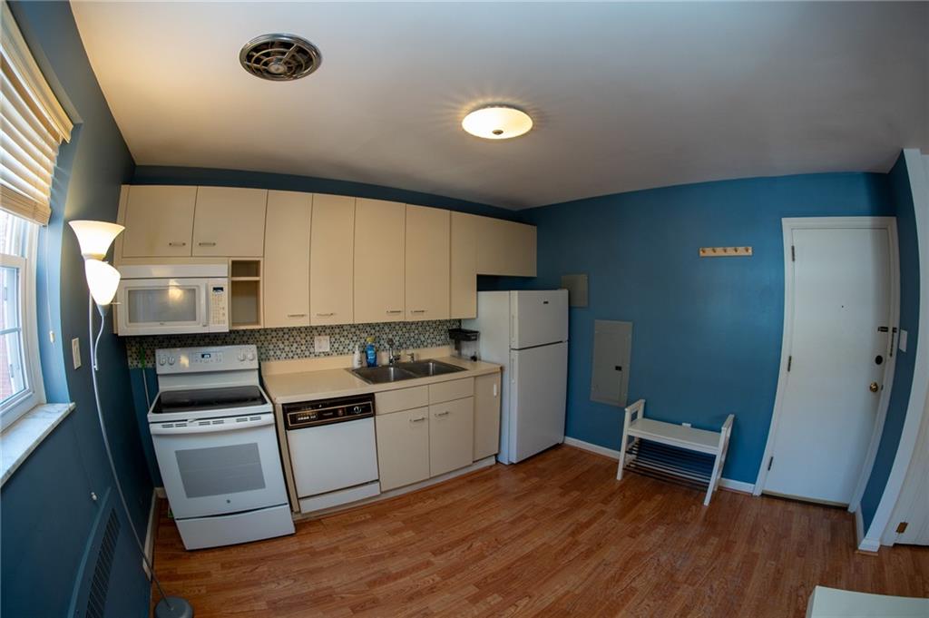 5025 Fifth Avenue, Unit 3F Pittsburgh, PA 15232 - Photo 6 of 22 a kitchen with a sink appliances and cabinets