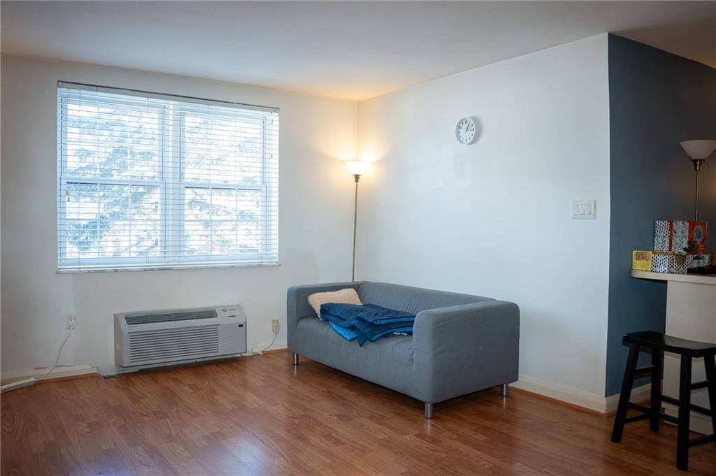 5025 Fifth Avenue, Unit 3F Pittsburgh, PA 15232 - Photo 7 of 22 a living room with furniture and a window