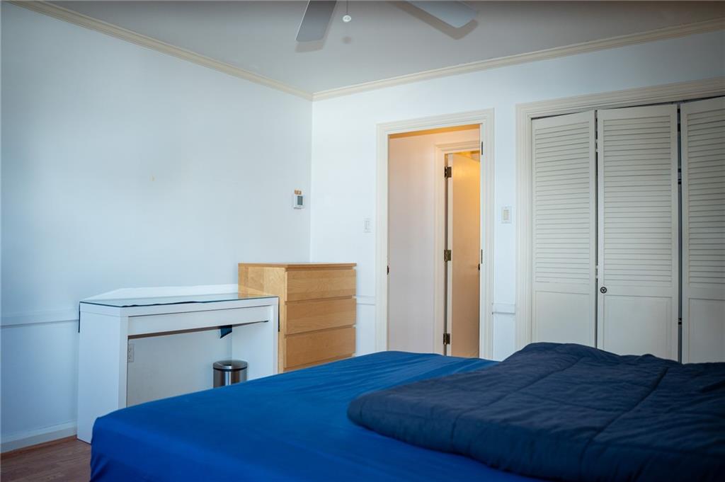 5025 Fifth Avenue, Unit 3F Pittsburgh, PA 15232 - Photo 10 of 22 a bedroom with a bed and a table