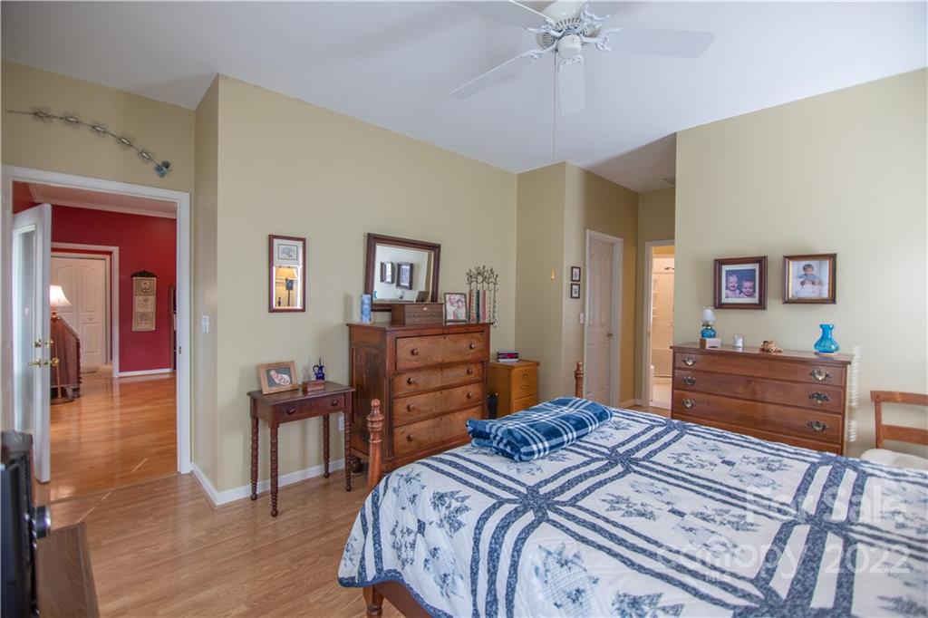 7 Sheffield Place Brevard, NC 28712 - Photo 12 of 30 a bedroom with a bed and a dresser