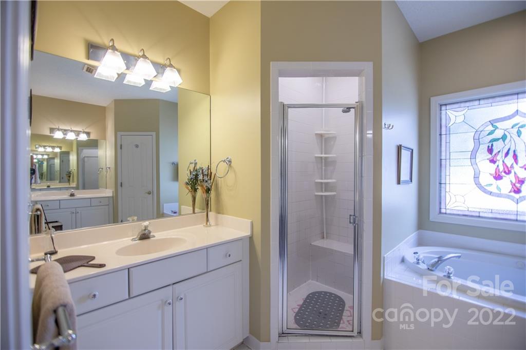 7 Sheffield Place Brevard, NC 28712 - Photo 15 of 30 a bathroom with a sink mirror and a shower