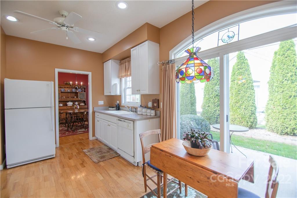 7 Sheffield Place Brevard, NC 28712 - Photo 2 of 30 a open kitchen with granite countertop a stove a sink dishwasher and a refrigerator with wooden floor