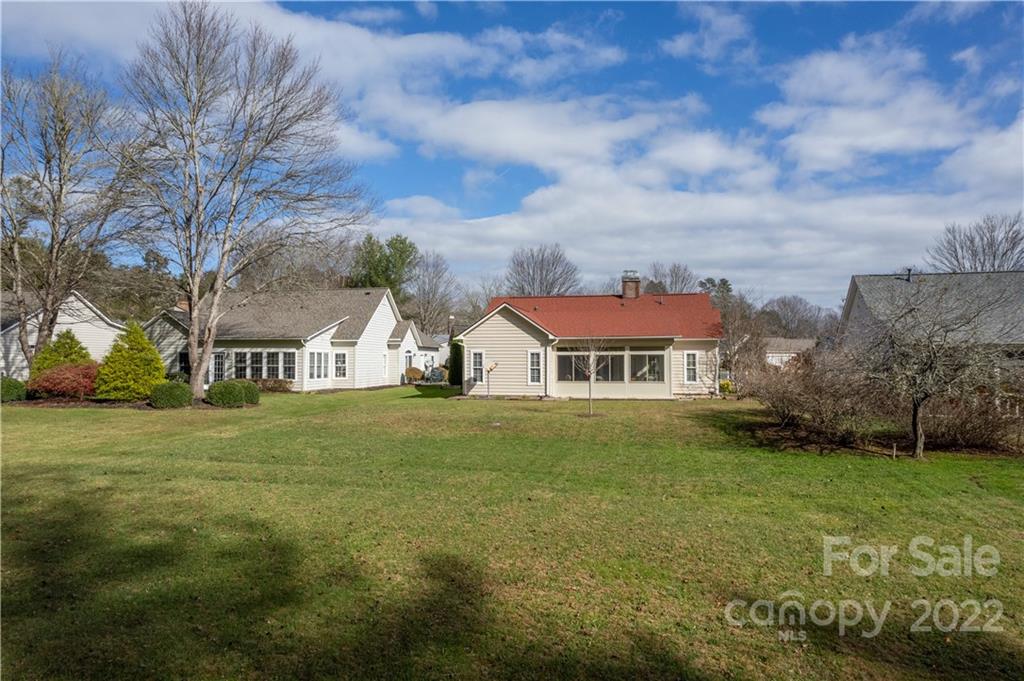 7 Sheffield Place Brevard, NC 28712 - Photo 23 of 30 a view of a big house with a big yard and large tree