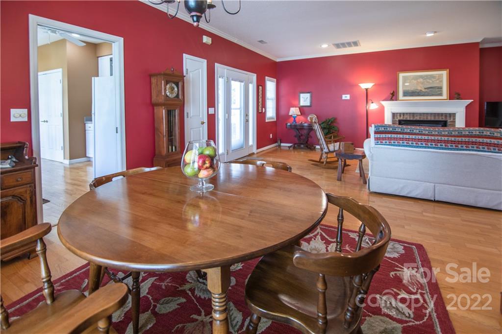 7 Sheffield Place Brevard, NC 28712 - Photo 8 of 30 a view of a dining room with furniture and wooden floor