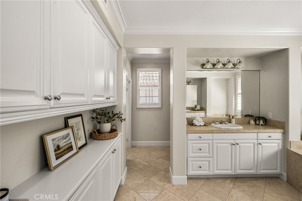 4 Lewiston Court Ladera Ranch, CA 92694 - Photo 26 of 48 a spacious bathroom with a double vanity sink a mirror a and a window