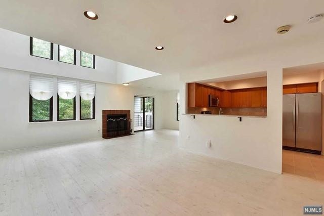 a view of a room window and a kitchen