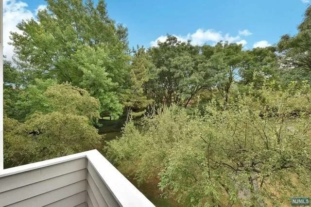 a view of a forest from a balcony