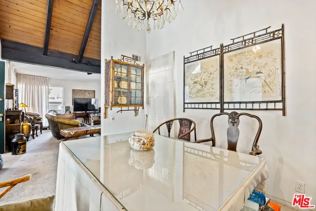 a view of living room with furniture and flat screen tv
