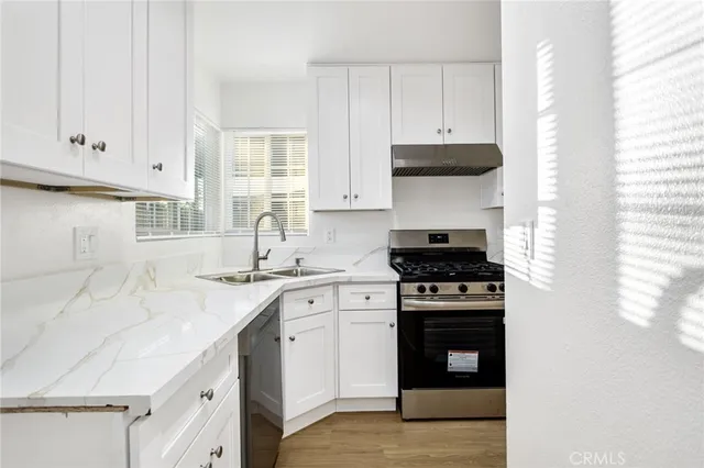 a kitchen with a stove and a sink