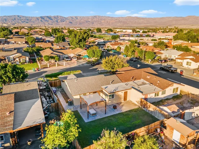 an aerial view of a house with a lake view