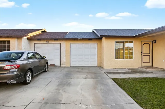 a car parked in front of a house