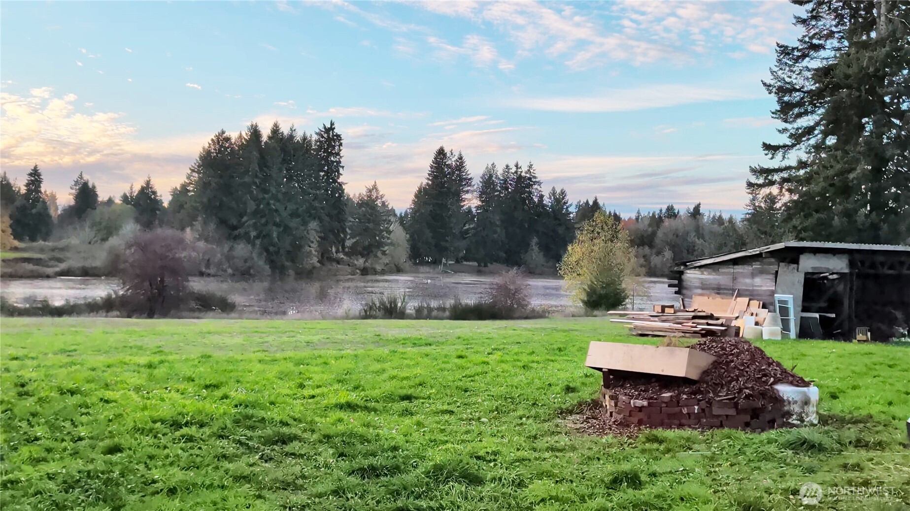 3619 Shincke Road Northeast Olympia, WA 98506 - Photo 9 of 28 a backyard of a house with table and chairs