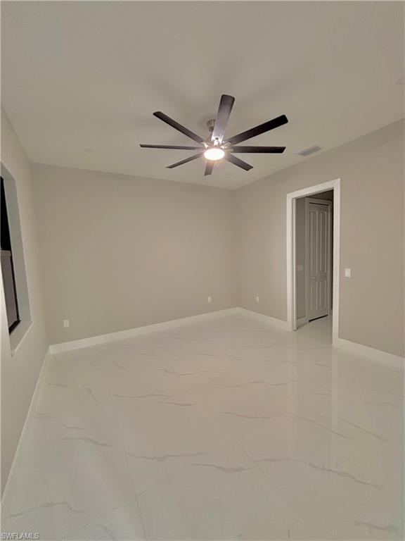 3904 12th Street Southwest Lehigh Acres, FL 33976 - Photo 4 of 12 a view of an empty room