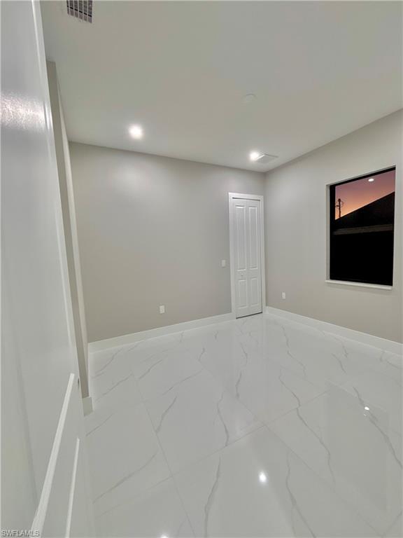 3904 12th Street Southwest Lehigh Acres, FL 33976 - Photo 10 of 12 a view of an empty room