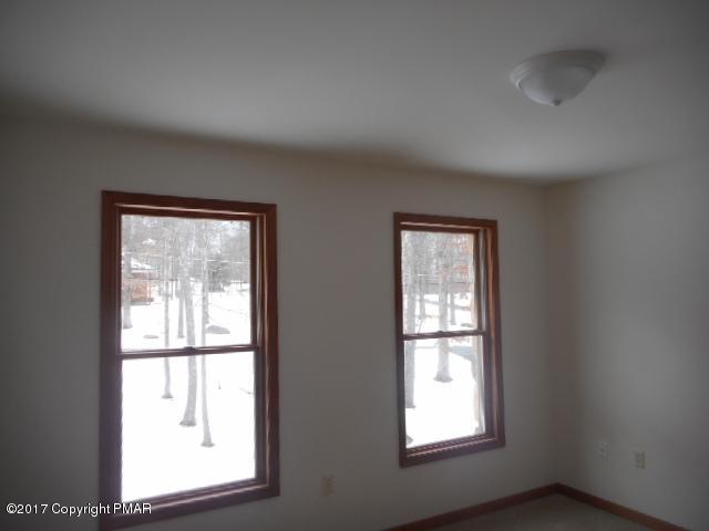 713 Buckle Boot Road Henryville, PA 18332 - Photo 9 of 12 an empty room with windows