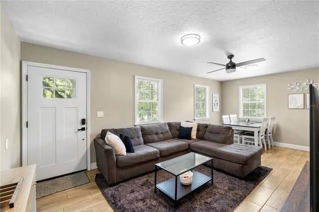 a living room with furniture and a window