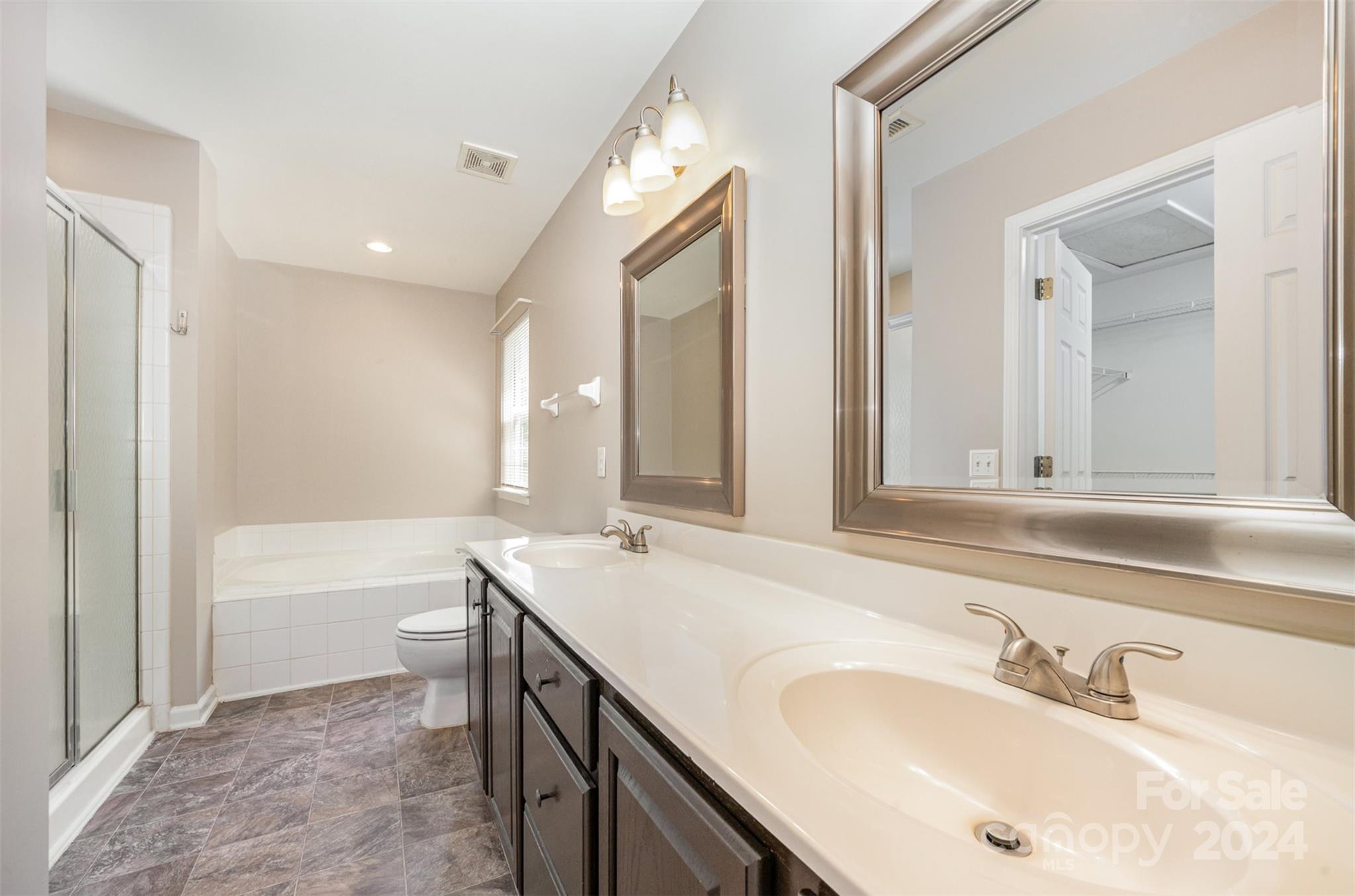 12032 Regent Ridge Lane Charlotte, NC 28278 - Photo 14 of 25 a bathroom with a tub sink and mirror