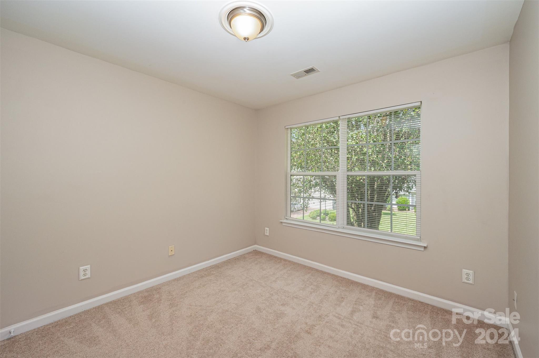 12032 Regent Ridge Lane Charlotte, NC 28278 - Photo 17 of 25 an empty room with a window