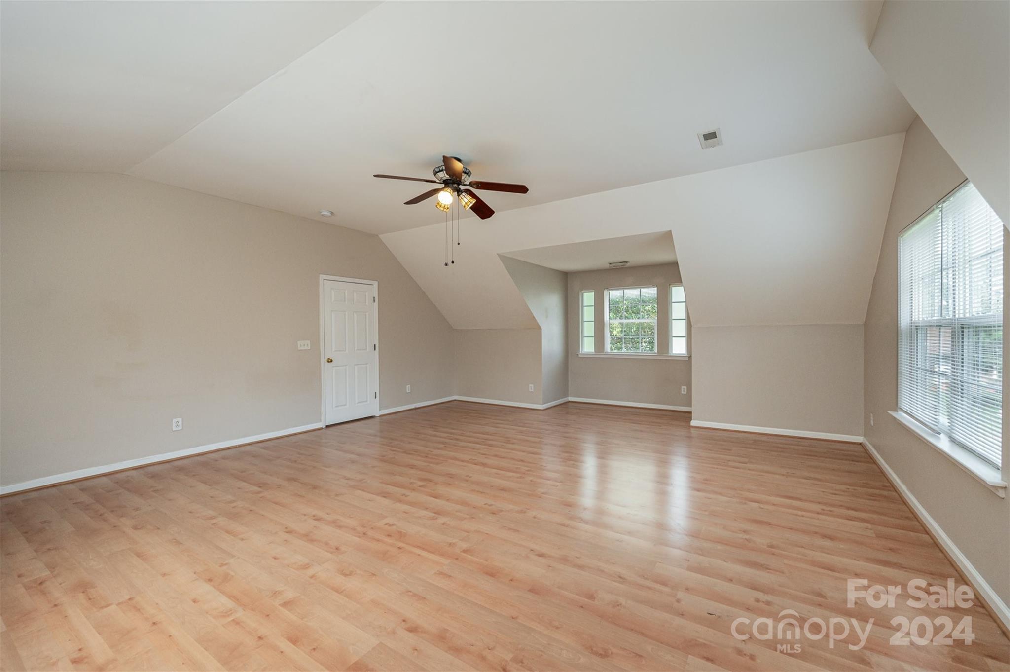 12032 Regent Ridge Lane Charlotte, NC 28278 - Photo 18 of 25 wooden floor in an empty room with a window