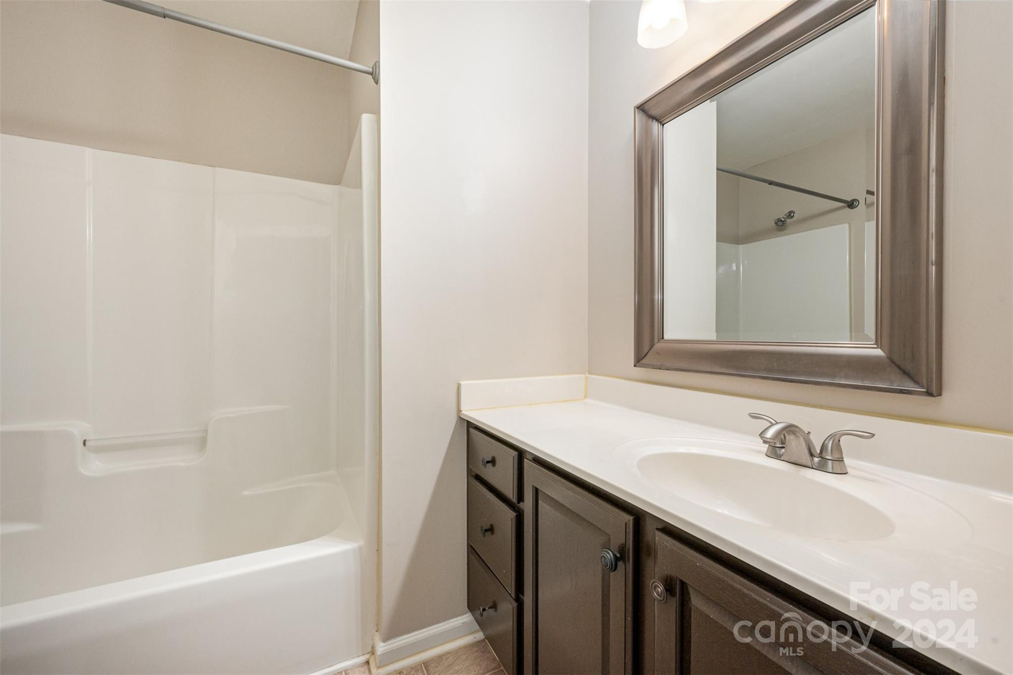 12032 Regent Ridge Lane Charlotte, NC 28278 - Photo 19 of 25 a bathroom with a sink and a mirror
