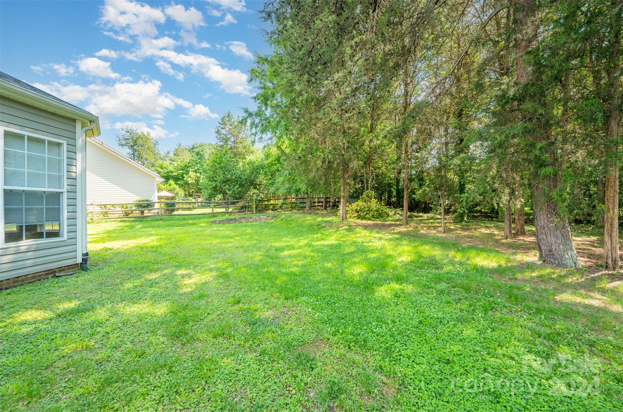 12032 Regent Ridge Lane Charlotte, NC 28278 - Photo 21 of 25 a view of outdoor space with deck and yard