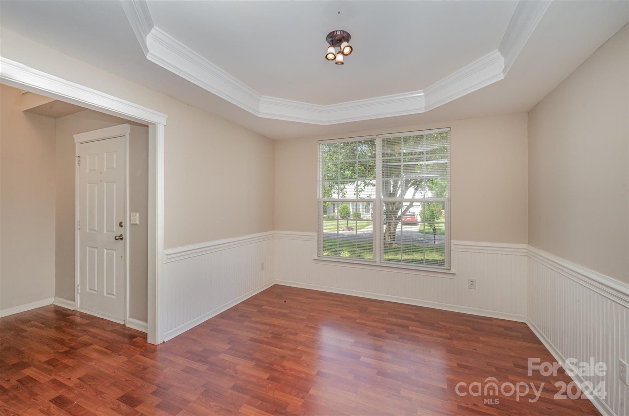 12032 Regent Ridge Lane Charlotte, NC 28278 - Photo 3 of 25 an empty room with wooden floor and windows