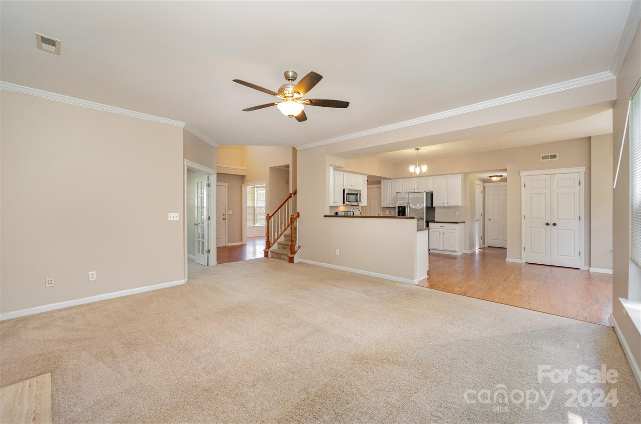 12032 Regent Ridge Lane Charlotte, NC 28278 - Photo 5 of 25 a view of a livingroom with a ceiling fan