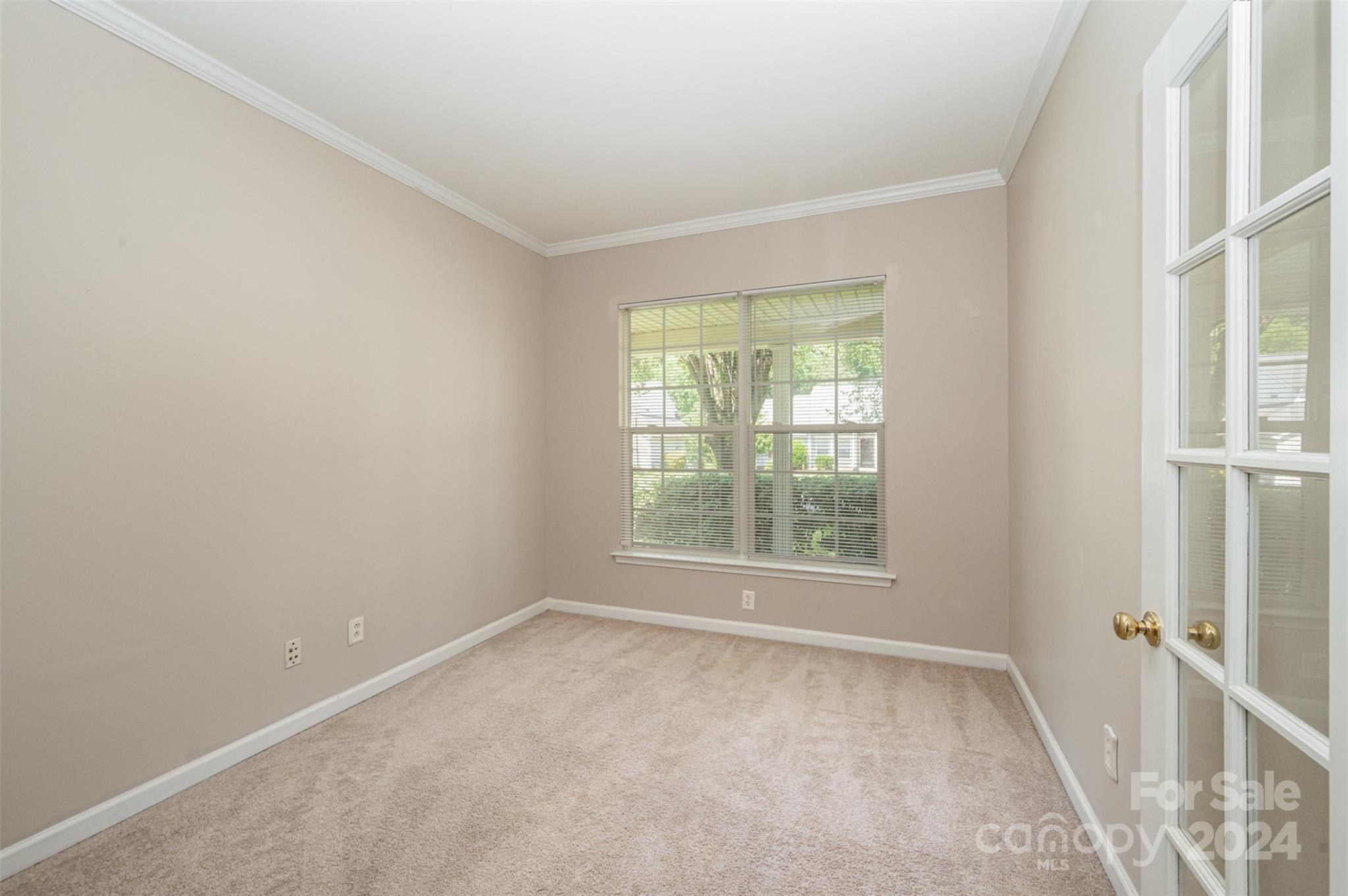 12032 Regent Ridge Lane Charlotte, NC 28278 - Photo 10 of 25 an empty room with a window