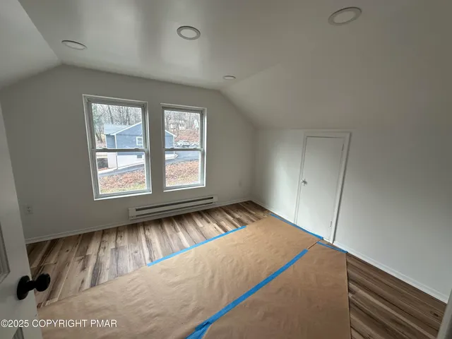 a view of an empty room and window