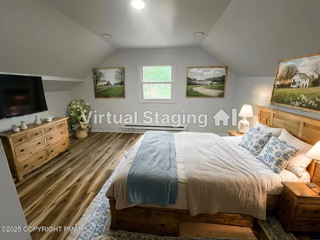 a bedroom with a bed and flat screen tv