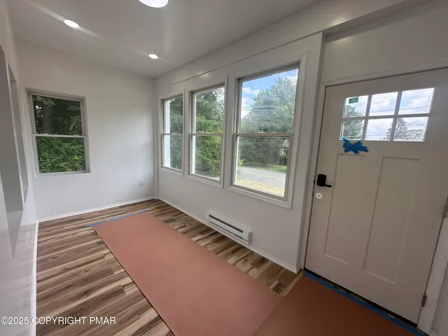 a view of an empty room with a window