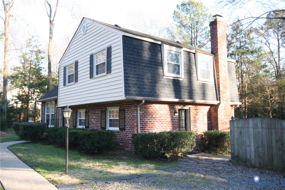12141 Old Buckingham Road Midlothian, VA 23113 - Photo 2 of 39 Brick and siding exterior featuring a gambrel roof