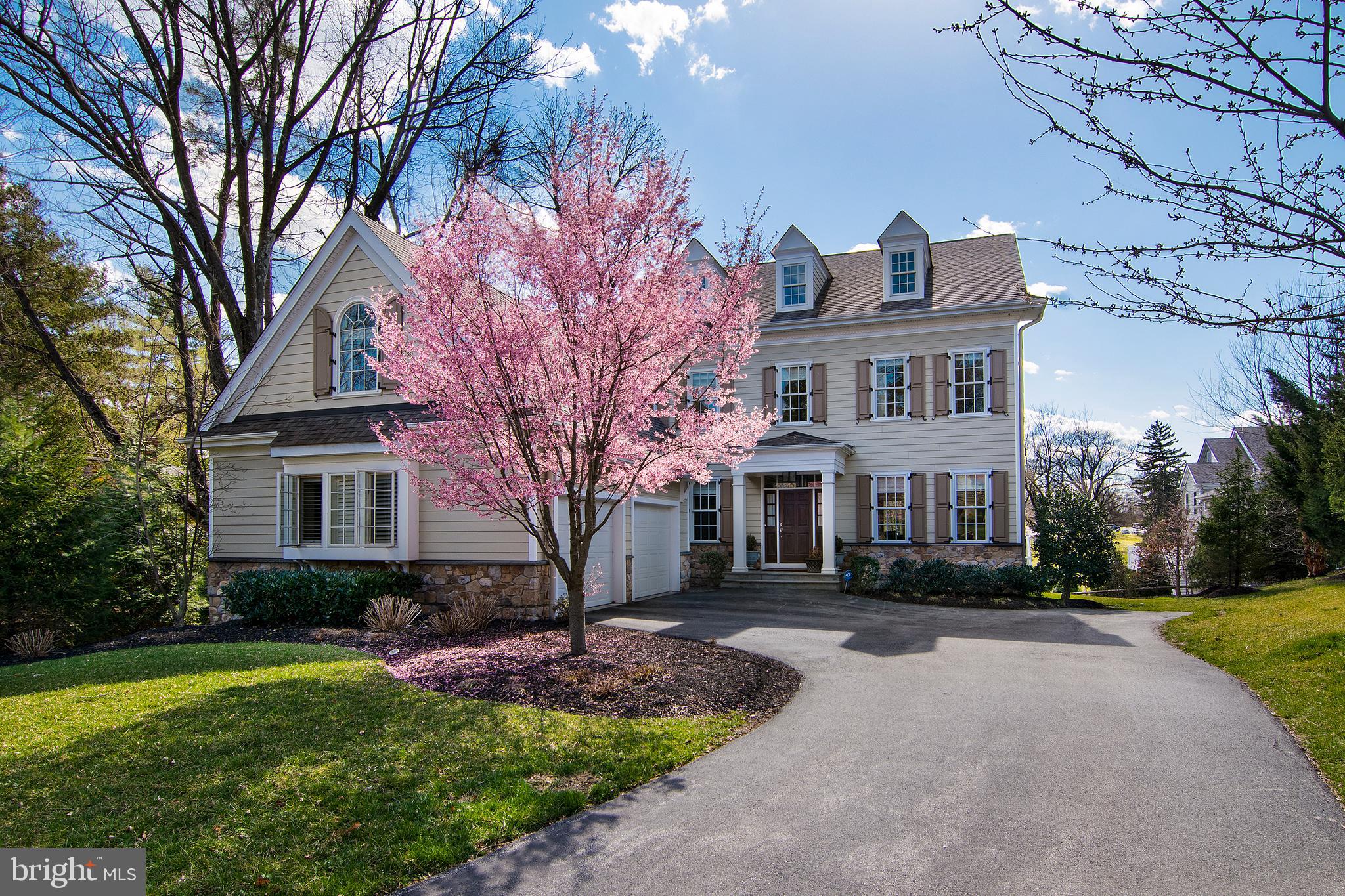 1428 County Line Road Bryn Mawr, PA 19010 - Photo 1 of 31 a front view of a house with a garden and trees