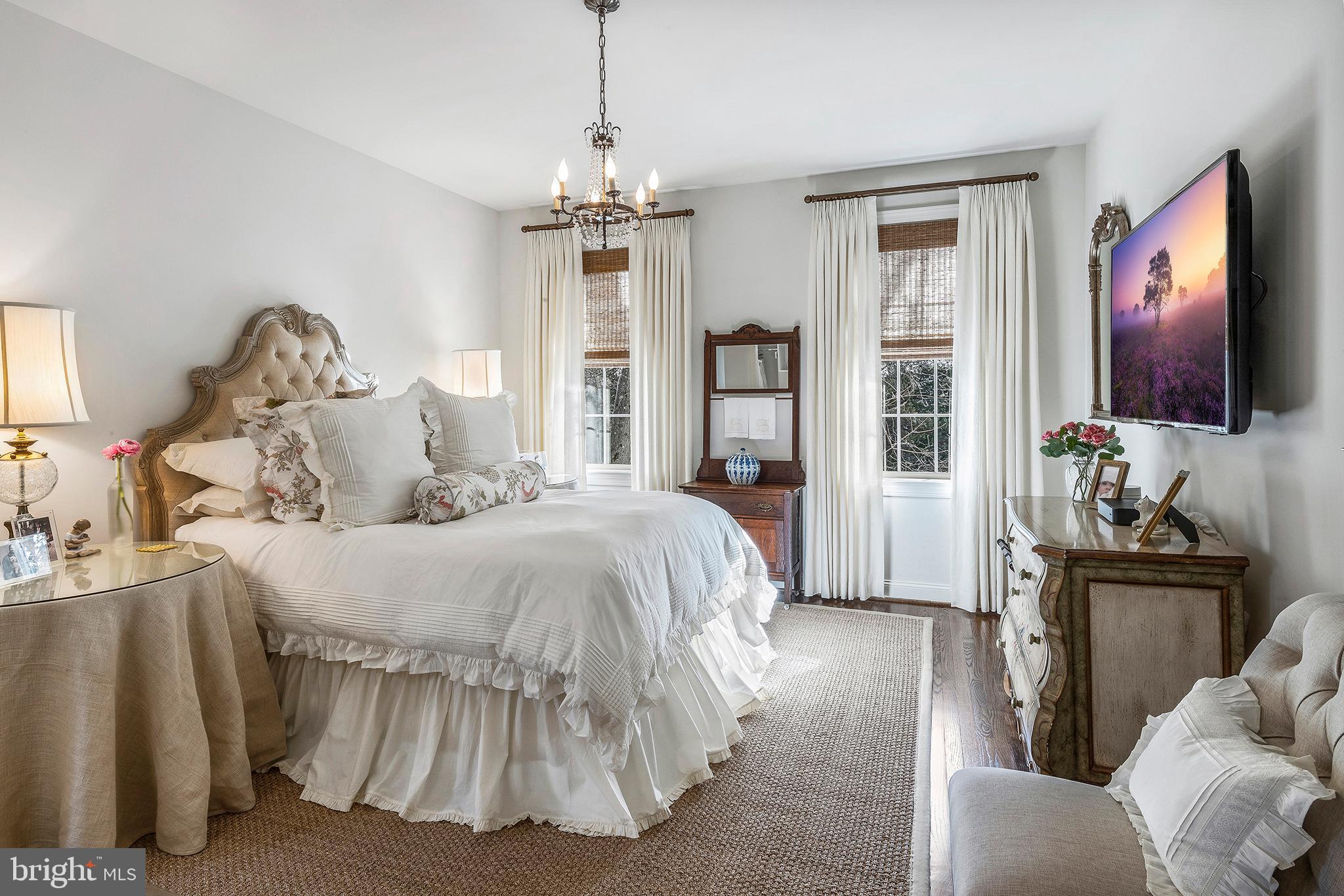 1428 County Line Road Bryn Mawr, PA 19010 - Photo 22 of 31 a spacious bedroom with a bed and flat screen tv