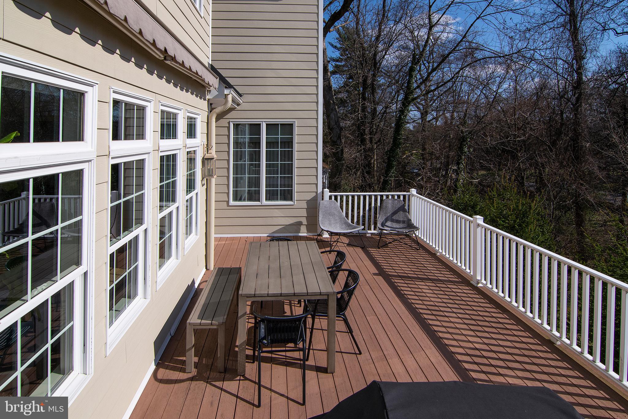 1428 County Line Road Bryn Mawr, PA 19010 - Photo 30 of 31 a view of a roof deck with wooden floor and fence
