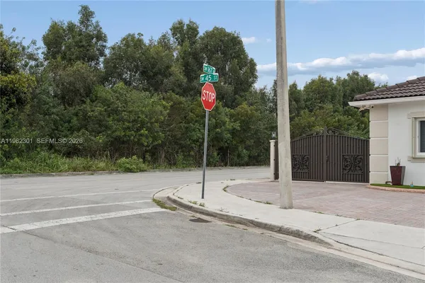 a view of street with parked cars