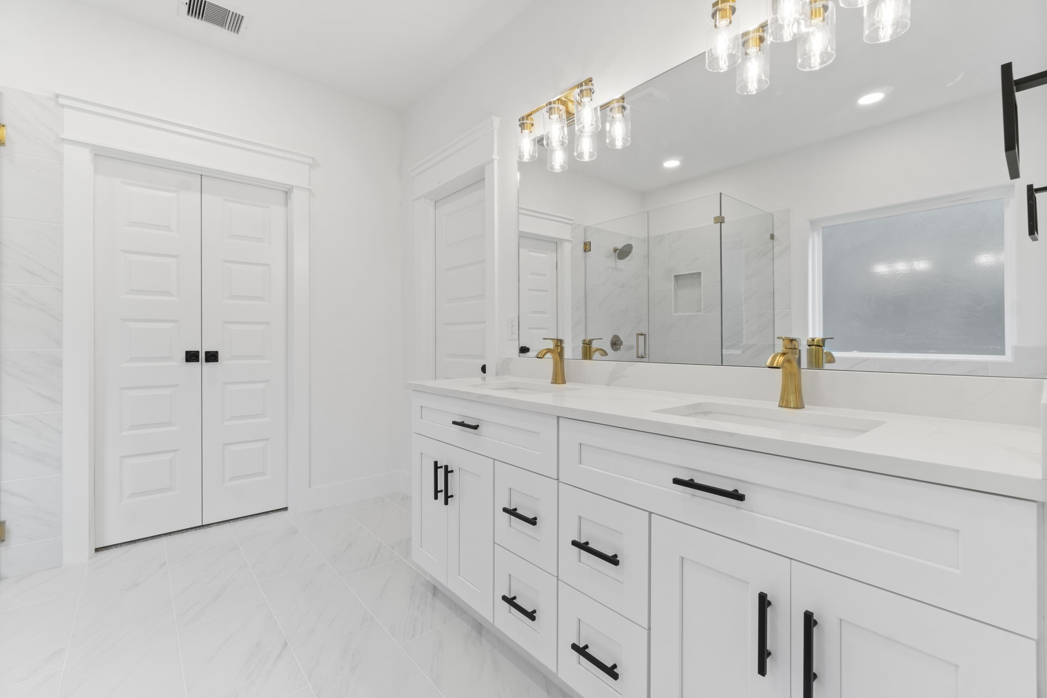 241 Clear Springs Trinity, TX 75862 - Photo 24 of 46 a bathroom with double vanity and a mirror