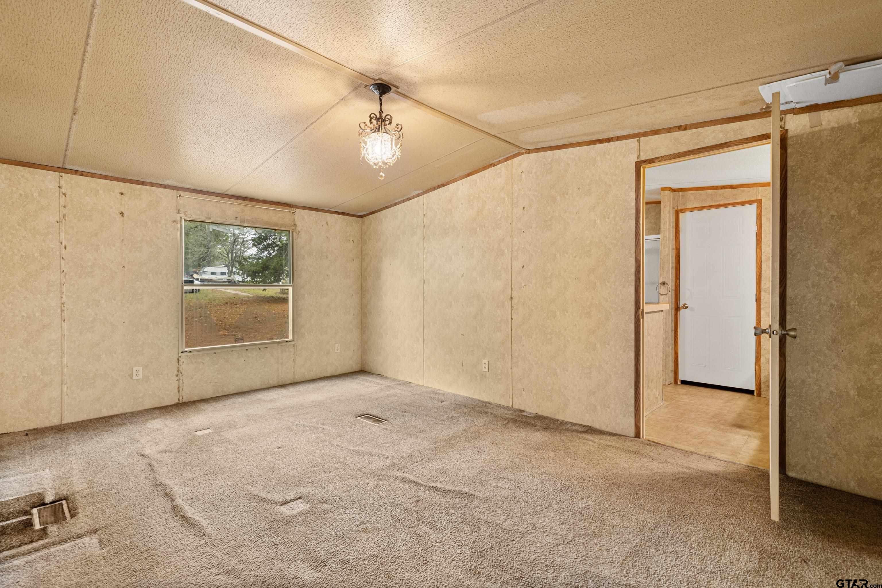 200 County Road 2123 Longview, TX 75603 - Photo 13 of 22 an empty room with windows and fan