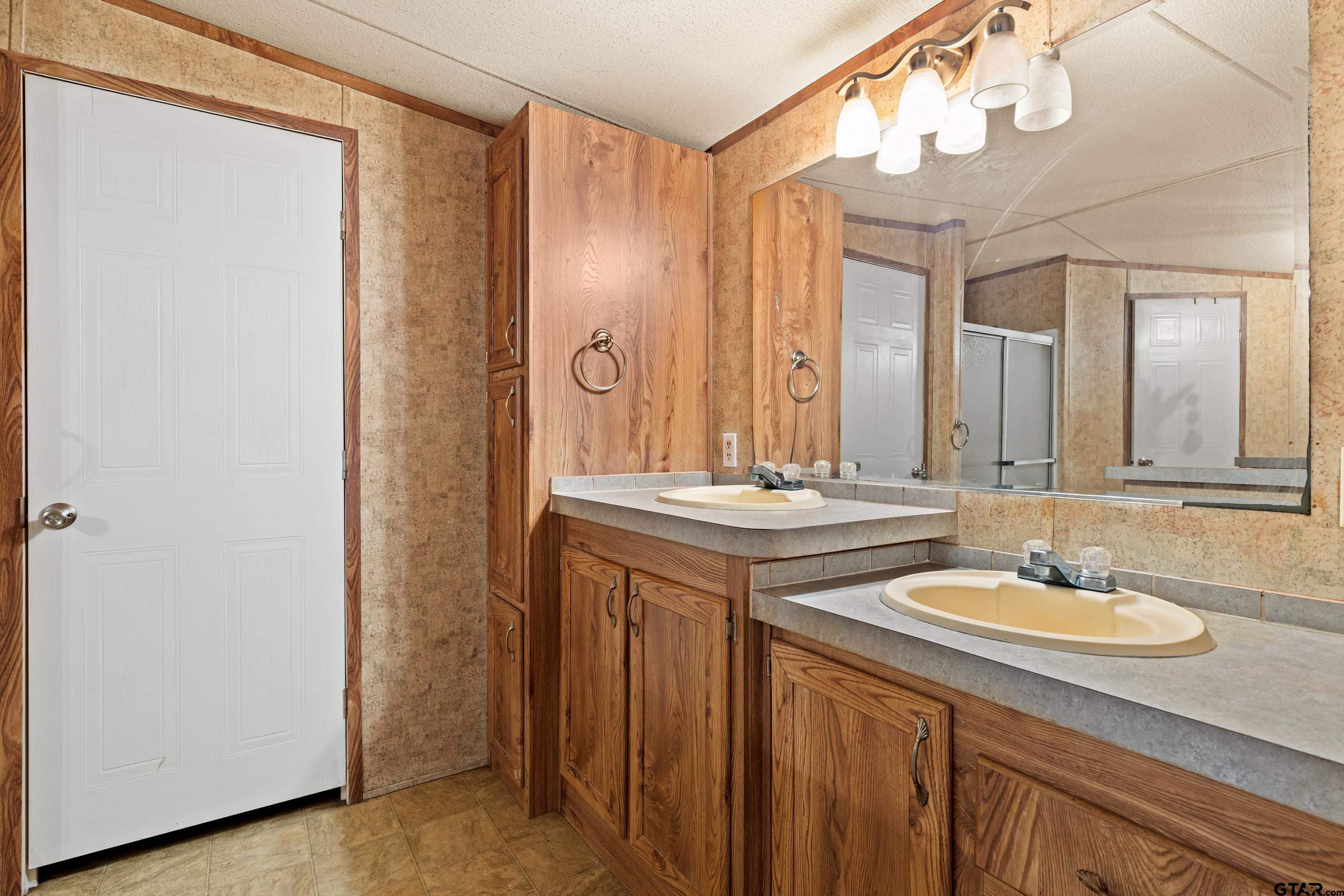 200 County Road 2123 Longview, TX 75603 - Photo 14 of 22 a bathroom with a double vanity sink mirror and