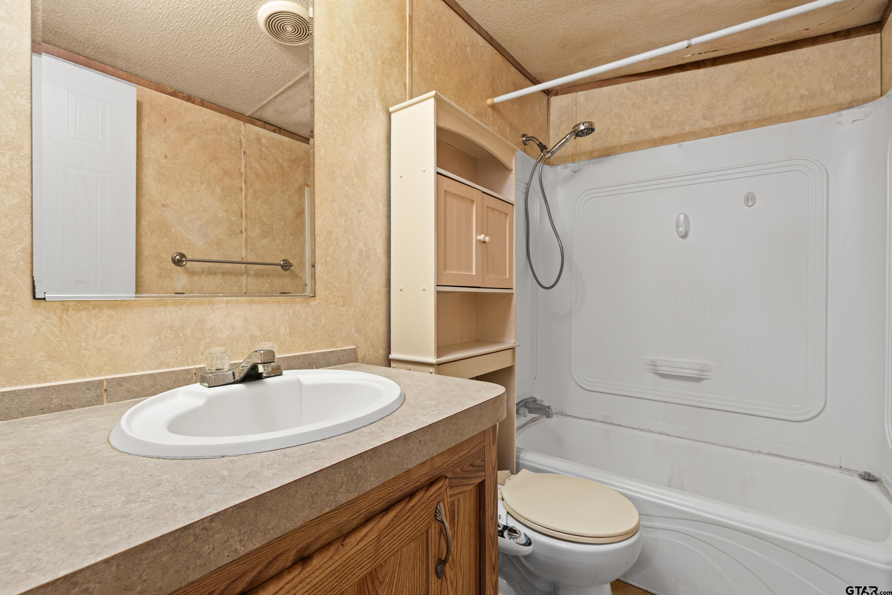 200 County Road 2123 Longview, TX 75603 - Photo 18 of 22 a bathroom with a sink toilet and shower