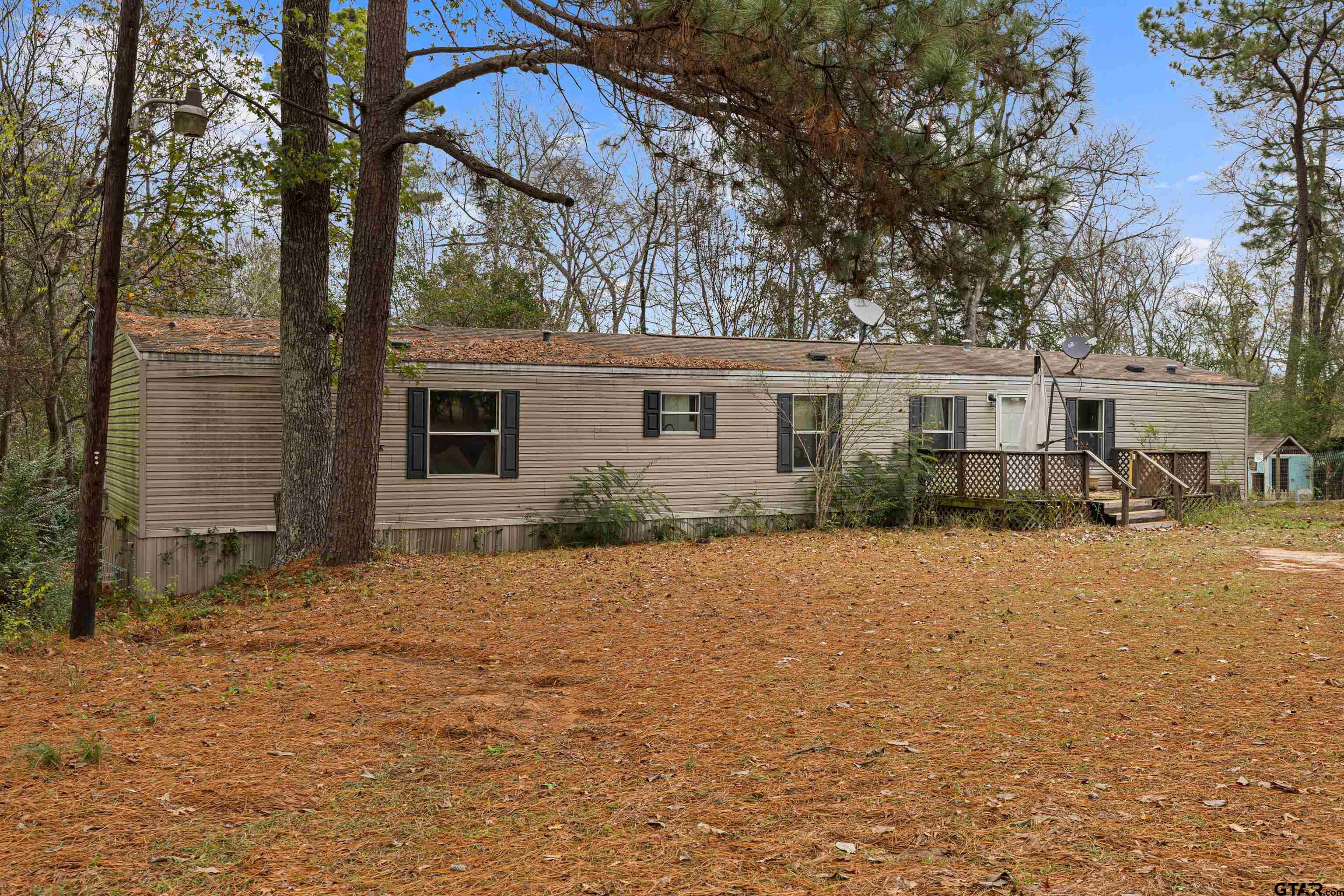 200 County Road 2123 Longview, TX 75603 - Photo 4 of 22 a backyard of a house with table and chairs
