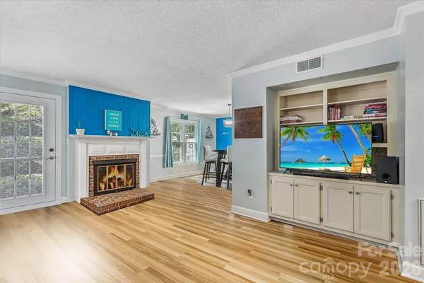 a view of a livingroom with furniture and a fireplace
